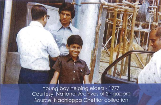 Young boy helping elders in 1977