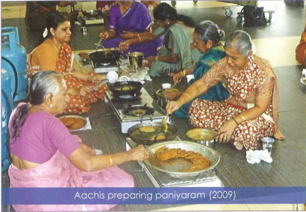 Nagarathar Aachis preparing karupatti paniyaram for Pillayar Nonbu, Singapore 2009