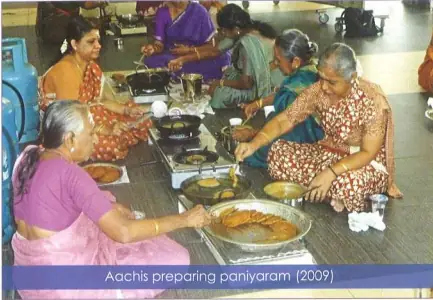 Nagarathar Aachis preparing karupatti paniyaram for Pillayar Nonbu, Singapore 2009