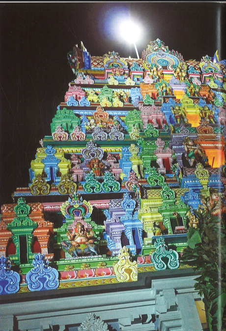 Sri Thendayuthapani Temple rajagopuram five-tier tower illuminated at night Tank Road Singapore
